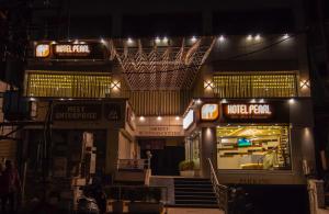 a view of a store at night with lights at Hotel Pearl in Vadodara