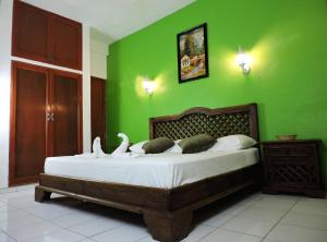 Postel nebo postele na pokoji v ubytování Hotel Valladolid