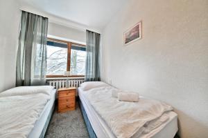 Postel nebo postele na pokoji v ubytování Panorama Gór w Karpaczu