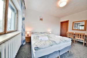 Postel nebo postele na pokoji v ubytování Panorama Gór w Karpaczu