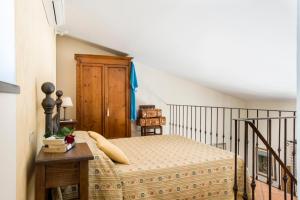 Postel nebo postele na pokoji v ubytování B&B Ponte a Nappo San Gimignano