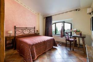 Postel nebo postele na pokoji v ubytování B&B Ponte a Nappo San Gimignano