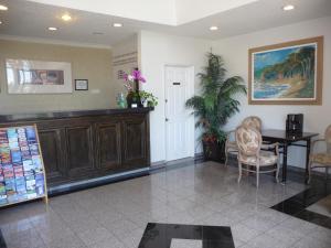 a dining room with a table and chairs and a table at Rainbow Inn in Anaheim