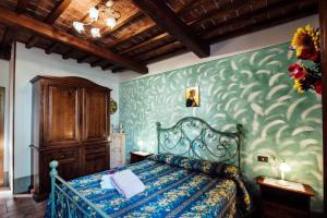 Posteľ alebo postele v izbe v ubytovaní Agriturismo Palazzo Conti A