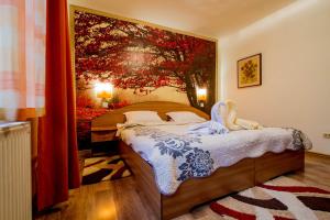 Ένα ή περισσότερα κρεβάτια σε δωμάτιο στο Pension Casa Timar +26 φωτογραφίες