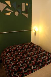 Ένα ή περισσότερα κρεβάτια σε δωμάτιο στο NeighborHUB hostel e coliving