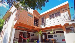 a house with an orange and white facade at Hotel Europa in San Miguel