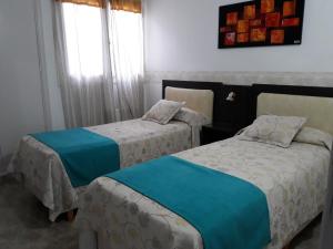 
Una cama o camas en una habitación de Hotel Adriatico
