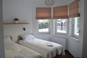 Ein Bett oder Betten in einem Zimmer der Unterkunft Kalinowy Sen II