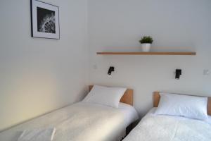 Ein Bett oder Betten in einem Zimmer der Unterkunft Kalinowy Sen II