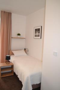 Ein Bett oder Betten in einem Zimmer der Unterkunft Kalinowy Sen II