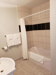 A bathroom at Regency Inn & Suites