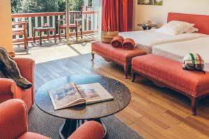 Postel nebo postele na pokoji v ubytování Hôtel Arcé