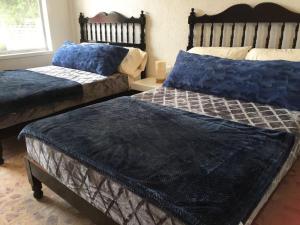 Una cama o camas en una habitación de Villa del Mar