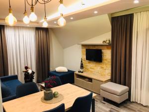 TV a/nebo společenská místnost v ubytování Milmari Resort Premier 46