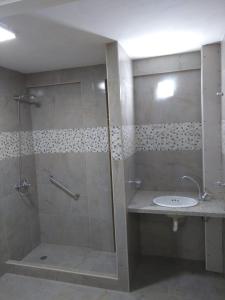 a bathroom with a shower and a sink at Apartamentos Croacia del Mar in Santa Clara del Mar