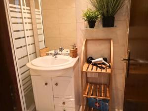 a bathroom with a sink and a mirror at Graça Lovers 2 in Lisbon +31 photos
