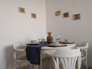 a table with a blue and white table cloth on it at Graça Lovers 2 in Lisbon
