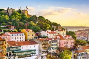 a view of a city with buildings and a bridge at Graça Lovers 2 in Lisbon
