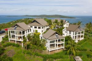 an aerial view of a house on a hill with the ocean at Dreamview Villas in Rakiraki