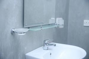 a bathroom with a sink and a mirror at Villa Greenary in Unawatuna +24 photos