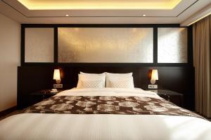 Postel nebo postele na pokoji v ubytování Lotte Hotel Ulsan
