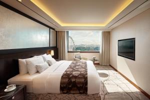 Postel nebo postele na pokoji v ubytování Lotte Hotel Ulsan