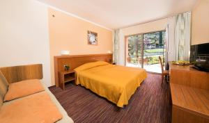 Postel nebo postele na pokoji v ubytování Bioenergy Resort Salinera Hotel + 33 fotografií