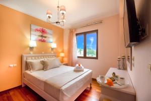 Postel nebo postele na pokoji v ubytování Casa Leone Suites