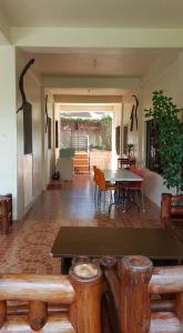 a living room with a table and a table and chairs at Sanctuary Transient House in Bacolod +28 photos