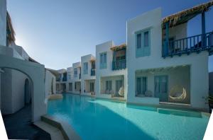 a swimming pool in the middle of a building at Resort de Paskani in Hua Hin