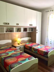 Krevet ili kreveti u jedinici u okviru objekta Appartamento Sole&Luna