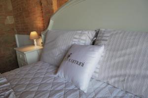 Postel nebo postele na pokoji v ubytování Agriturismo Due Comuni