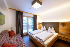 Postel nebo postele na pokoji v ubytování Appartement-Pension Kendlbacher