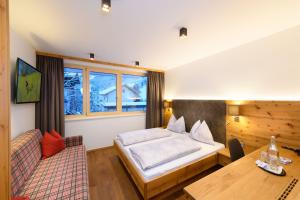 Postel nebo postele na pokoji v ubytování Appartement-Pension Kendlbacher