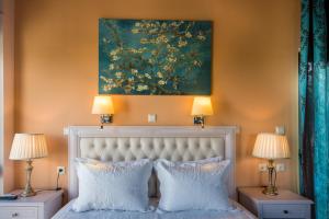 Postel nebo postele na pokoji v ubytování Casa Leone Suites