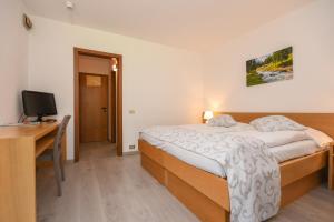 Voodi või voodid majutusasutuse Bepy Hotel Garni toas