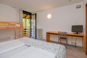 Voodi või voodid majutusasutuse Bepy Hotel Garni toas