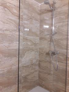 a bathroom with a shower with a glass door at P L Sunorama Beach Garden 302 in Larnaca +42 photos