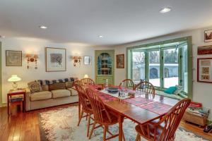 a dining room with a table and chairs and a couch at Mount Holly Home in Mount Holly