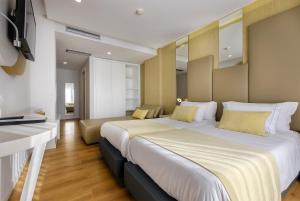 Postel nebo postele na pokoji v ubytování Hotel Rosa Mística by Umbral
