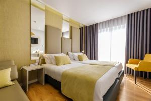 Postel nebo postele na pokoji v ubytování Hotel Rosa Mística by Umbral