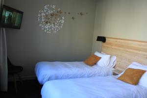 Postel nebo postele na pokoji v ubytování Mon Hotel à Gap