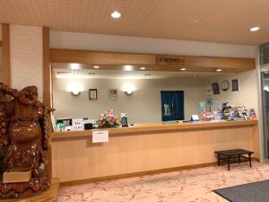 a front desk of a hospital with a mirror at Hokkai Hotel in Lake Toya