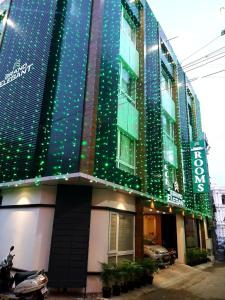 a building with christmas lights on the side of it at GRAND ELEGANT in Chennai