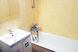 a bathroom with a shower and a sink at Tubarinho Apartment in Costa da Caparica +14 photos