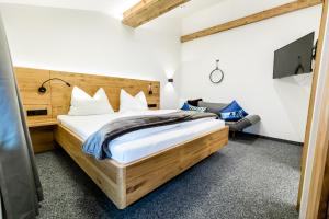 Tempat tidur dalam kamar di Appartements Retthäusl
