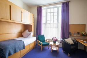เตียงในห้องที่ Trinity College - Campus Accommodation