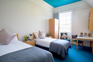 เตียงในห้องที่ Trinity College - Campus Accommodation