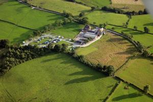 an aerial view of a large house in a field at Yurt with Hot Tub near Hartington, Peak District in Buxton